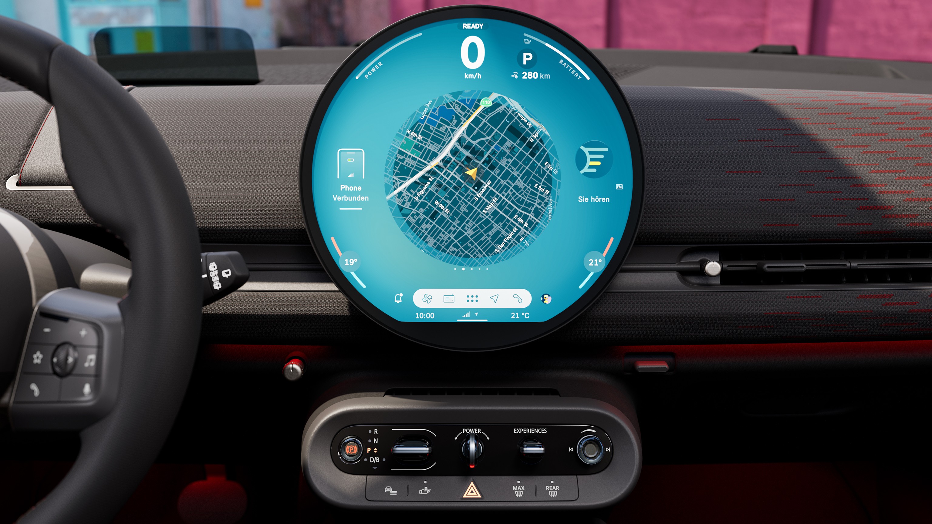 Panoramic view of the dashboard of the all-electric MINI Aceman with yellow wall in the background